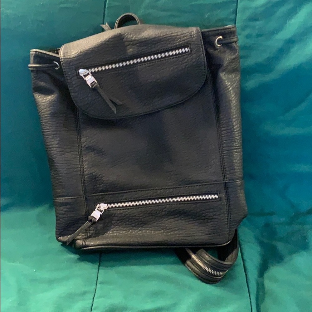Drawstring flap top backpack